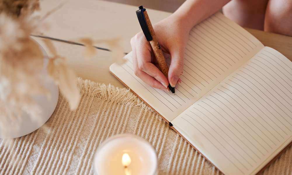 woman journaling about pet loss